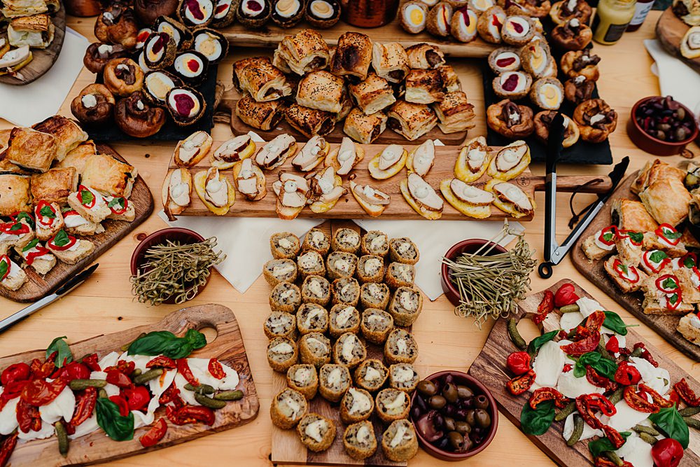 ## 14. Elegant Cheese and Fruit Station ![Image](https://images.openai.com/static-rsc-4/V5ndKWdXGeI9vdCi_koUc8IPNV0CzSF54DFkjpmuetaaiy7IzyBZrjo9DM3x79KZOAhvfeOb4NsVMJhwawhsPzxO2mZOeLQ3tjEj15oFVNZCMt4SMJuMWXvBrN3teRs3h4R8l76Pj-hS0X8Abb_ER_CbdUbyYWNKcUrIJG6GqgxC7YVi-Q4XxMtp_M-mc85r?purpose=fullsize) ![Image](https://images.openai.com/static-rsc-4/NxyX-xYi-XPO7mkyCrRKCv4O4Zp18W3lt6aD9H9u7MEcvj0n19aiwgUZWRmK6W8FSQ3ifnSGRMSd9Fk6JLJ2Aqnj6ZZWNTuYXDzosZehEK91lzdIostMvH_65Kx2x1FaV8TFG8C9YUHD1trU5vgVuAm8pw4YJD0TObTBg7SKAE7KawWsZsyD5Elhf9973ZDx?purpose=fullsize) ![Image](https://images.openai.com/static-rsc-4/meJWFVVpQlW3z4gLOjeMP1V1ptYweCvsigKxfGToNqWlXto38SQeHshBl1go8qC3OBJv_59JS4RlXE_BsGnJT6MtS669HdFjTgTs7XuN7tXg4oWVUwDgc9_l-0kisrdu8iXrZMEI2NMcO4juQC89N8MREtzbB_sDv9gXDWbBlX1pfblKhJtWRzKCKN-Is_74?purpose=fullsize) ![Image](https://images.openai.com/static-rsc-4/0LYmJA0ovqUZXq6RJxLIpOF1NMw2pvy0Anb509xnagrB0Ls3F0Hl3XaT_KHThepXpf2I3M9SZ9qGF4ulS6H0UZhIaoBQJXXJrjxSALpnAZm7_DGvDR4CP-36nQwhIg07ROGwtegUINQ0OtGJ2LT_u6PRiPETBdxMPVJ0cfW531YUUxGWZ4a87uQHVBbr8ykY?purpose=fullsize) ![Image](https://images.openai.com/static-rsc-4/OuKxDXdBj7BoLjUJOL1oDhl_3syyVpuRyRM0PlGG4dtxQIu_LLdsQpiznE8ZlRvKLc6JDdBIUcv_6FrVCaPLld8BBRNCcqRHCcRhHb79opCT5fhU-ZAxAX2_CdM80KxW_eJZFnY17ITjrnNJN4ld5RigKH3pJ0eXIKhGo430FMwYTjTGzLXf8voMctnAbnY9?purpose=fullsize) ![Image](https://images.openai.com/static-rsc-4/eHQpJ-_pH9xPTHoiN9G-gBMHzrIk-xp4Ab1e5dxPlq586us6B6910t_gmKtlT_1RAIphlc12AWe8lY42wja8IOSEAPdrwllVyHCMyElcirfxGJRibB5EjRbbgdxGOEnvQwEgr-At1GKvUkYIS3dna5QSV_VPMtOUBlKE9N2xg20-tnjQjFMyT817S3h3XpDc?purpose=fullsize) ![Image](https://images.openai.com/static-rsc-4/gt5jjfZ-y314HEF5rrw7MhREP6tb0hBKpro4u9Gld4T1s8OLR0pqw4vvYzNEQQJ2ETBY3shyTXBgcfPrzNlcB1yS3eDIVyBIAiXYDoCCCTMnhSlivcw1cMR8Pzvg3l485JFCutsWCkr1jwyLGH1uOj0KygsifIqXa_h49hRxpa-lo3YGhA9YRqYlv_RAySuv?purpose=fullsize) Create a sophisticated cheese station with artisan cheeses, fresh grapes, figs, berries, crackers, honey, and roasted nuts. Arrange everything on wooden boards with fresh herbs for a beautiful presentation. The combination of sweet and savory flavors delights guests. This elegant station is perfect during cocktail hour. ## 15. Gourmet Taco Bar ![Image](https://images.openai.com/static-rsc-4/Uuv6wGxQOWYjTxR0VSJ6fWUXGhOzJBI2e9pnR3GwCx1riyKQlupsjcxGXX4VZidhkef64NOBpIdOitiX6NwZJFP5vHn1wEs339hvS1ZujLrhnrxqZxStVluyy_db6UBMZWyG7uceC8DwSwPukAdTqhKDB8cGQvgg9ijSwkCoW5f5NwJgDqODx5XCNEnac_N_?purpose=fullsize) ![Image](https://images.openai.com/static-rsc-4/u82TnOA-NEGsBZbroKgFInTbpjb_6qFbfbT3nGgcpzTv-fbunScRpB8x0NBS06BxklOEssa9Qe3AkNkgrR-YMl7r7Cu92Jw0btbK-gpcKV_HGjCA6o_a4QgUCqzbRIeWjLqH_29HRIqo9tBF09eIJnruwXIhgrjqVcodlKrqHNVk-MQXEI2uqhEm5o9jpGEm?purpose=fullsize) ![Image](https://images.openai.com/static-rsc-4/gBKpCWsSVREWz1dak8lI6M7OhSg5DjjuCwRz_1vlm83EbZYwYzSwa3vvqEsbZ3qH7qOcVUPKfx3dFkUPuVpfg0lJ0fAGovsbhuiOzI_F3A1GgquKrQfJ-0LiPsdi70o1inuB4cQ91cWojBu_VzZnPGum4Ye4zP7PNRK2voyqb2isc8m8kROBrS6jErT60Ljk?purpose=fullsize) ![Image](https://images.openai.com/static-rsc-4/aKK-82YvmsdhdHQOzBvox9t608EPi9qrmVh2RTjpa3g38lAxo1K8sHfzSOpJ5f-Px8Rca5IgntP11kcvW7DXd5UXNc2__uGjFOEyv13NjNinV2Rrwfhtc4tj7ToTjhTNA988RZ8M9tSK3v-ugBvizAtTfpg1JNQ9Pbr0M7Ft7R2bQTRJkwGzuPFqD1OeD8Qm?purpose=fullsize) ![Image](https://images.openai.com/static-rsc-4/sodChFUxM1daY98OMtYBZ5_10-hHe2XTR0BsZzhfoPjq2bU_IrhEV4PAoAarA0CzR1btIev7x6ZG6_gGzXcKhbdGTAWaOs2aSXymQw_Wsn91KEGJEx6pHUV9HfNy28Kon05kemd2mBOeUkdF3JU3v2OzEajgXft8NvHAJfFO7Rw5XygA52_JZTXJPuGsvmCu?purpose=fullsize) ![Image](https://images.openai.com/static-rsc-4/JG6XPrB8X5SdXj63mtIKXe7Z15At7WKh1s5uAk6xSpEIYV4i9MXDgcnblF6ygmhZy5fC-LQeEGl2Smz8ZhVh7q1u3PdoDBLnqVPujwSQDC8hTwynXxcj1pbEmbp18PYuWy-RxGUy3MzFV7wEXU3c4Cj1ToXROKz6dD9AyX-j-nCEVvJEs4HNmeceG6QnWJ74?purpose=fullsize) ![Image](https://images.openai.com/static-rsc-4/hzh3X34K2V7S9ud1nJfAU_mqvkwbeL-iUgkFn3s8vZGAaztctGFN5_enkQIq42rRq-8K7s4UV6QyfjZOX287GtjH_cKp-3F5OQMbyaAZW8NlNQ_ZfdWpK4R-3nEYSBKwlpcC7cD1Mtb9tWPvAKBer162FnAFPTBnJw-ySXBtQ32pFamvPLM4F_zI3fonNuOU?purpose=fullsize) Offer a gourmet taco station with grilled chicken, beef, shrimp, and vegetarian fillings alongside fresh toppings like avocado, salsa, cilantro, and cheese. Display colorful ingredients in elegant serving bowls. Guests can customize every taco to their taste. This fun station adds personality to your reception. ## 16. Mediterranean Mezze Table ![Image](https://images.openai.com/static-rsc-4/nWSNCugRTE3Zv4G9GtxegNBAM37P6IFfEC4GqHHV03Gy1YvdiOs2TOGuooacKpkcb7qDL2cdrtczgwOJE84Ctog7s2DRLQkzKTTYOwwEAy_KZy1lmGJhX6j8TFly0KPeZiQCiRgk6WdZk6QUC_SqhFQmxvThv_FRG5gpAHkjZ9XrTHPZ173T7SRZMJdrYQp0?purpose=fullsize) ![Image](https://images.openai.com/static-rsc-4/swKHhqqwMj7QZDmVO10GZRPkXy200pEmCUb3tMnSx5diYj4BPdoNpXX2VCV_EH4rNoCAxzONH0g9ijs7Ue9U1xrWSQX4Vt3_Tv_UZEo3OZ1NC1Kl1OAK3_1EzoywI1yvhr9tKm-n7RmTHSsxVJNIpt_O7-u1RLzX7PtiQr3R9e7CL51N69PMk6c1MQZRKdRA?purpose=fullsize) ![Image](https://images.openai.com/static-rsc-4/2idKcj7ZA8Fr81gAM3OmqELqjwnWQlmBpZzkomjpg0lYrul7hoMKH607Qu-wbJt2c5TUA2_kgx4BFYjR7sYgGRIpxGDyxDaM9F1nROg8sXWdC4LmecQ7bztSTpJUFw8l0T1VdpW53Qv4o_sOlCu8S6Di_ddm3_Rj0FSnfvYdgtnfA4BhPuds2wWyczJOed7B?purpose=fullsize) ![Image](https://images.openai.com/static-rsc-4/vA5Z7WpVA46qYdUBatnBnXDIxvvKsRSOWatT0GK9oA5Rdl-m5P_bmyTzi2xxxl3SlVwBjULiVIW2pv0-yZDo6EOSQ_nBavcf7zaehe945fQxIq53Iav-LKzsDCOTC0_xXwowYhpyMTS-PdzvkLSJAcuHM-8_uIOKj634mdczyyBM7_PNVeRiHBCH2mIBnpwu?purpose=fullsize) ![Image](https://images.openai.com/static-rsc-4/y6IoxdTOKRl459quQtOzvwUnTgUsNm5ah5N-smHwAai2Zooo4hzc8KBF6a-_6rPNi2ZsT-MwjTz5iiXe8_4X3UHgtUFO0WgA58eWDoUyp1eI2Gfdcm7ePjXdmmUqNUhAJPwgVtTX1MvkYXUMNXUD0Ddg7tQ9ZsGeiHiEiPHASqdHVJpec4WRqm1nCGlP2X6B?purpose=fullsize) ![Image](https://images.openai.com/static-rsc-4/LDkmNrZLTe0FgdPfuCrdYNTmvRW7VqN1ow362_bsQA8s_TXCu6Ua0K5EksK2i6bRMB6Q7Uiq2VwcVWBs7sN2gr0sxpobz3goMLWq_iDdZmIxUbu4xQrbXN-Z0vzSezNARQ7CqY8Tj-uUuIKcezvNgOa-6A7qKI5WA4hSfLrU7LySvG77EIKyqhB80yipDuLo?purpose=fullsize) ![Image](https://images.openai.com/static-rsc-4/y9L_n_jMz29YbUMaSe4u0wrDGq6KDZj-mixp413DfYT8pBKZT8TnwFBugNj8GPYYqbR1T2D98-P2Fez_B_ql23wML48i_c7ob60yiK5isHato0lY5nc4ksD8uGvhzvDHbHdaVcwXLswdZsdtuMmn2a0cSduyVYOpFXN9FXEDgySiEWHCBYvwwpl3o5YqUaf0?purpose=fullsize) Serve a colorful spread of hummus, pita bread, olives, roasted vegetables, stuffed grape leaves, feta cheese, and fresh salads. Decorate the table with olive branches and rustic serving dishes for a warm Mediterranean feel. The fresh flavors appeal to a wide variety of guests. This elegant buffet is both healthy and delicious. ## 17. Signature Mocktail Bar ![Image](https://images.openai.com/static-rsc-4/rbrvmoOEXA_rIKueg2Nn0E62E8iTmuHYVeO6xQMoM6zn2ty4DT8dlZrpx7Z8YmL0iSLm-PCcN3xkeXZaVHfn45BtrE9FwIOYAY-fxhUCsRnERGBIa5Qt1NEHaJbvqEq2apU2Lw6bWGYGdQLbeYCCOE7Ma9i4BH6uQgD23bXLlYOo6tszCkDOjrLrmw0GvakB?purpose=fullsize) ![Image](https://images.openai.com/static-rsc-4/lzu-eB_JKsfVgj2HfODff_z38yYz2npgQd602YQgLqsQhsqreB_UQgpYUfEKovyzPoQJ7BGcyKORW_xQFlYO8OwkYps6QBAa978ay5mQmCL6bHstUs2zoKN2O-QM8cQaRrjYzgHbgcKa8XAgFUKOh8dlp3xRn34U8P1GTiKi15fwpgDwtpqPCcldLSCSGi-Z?purpose=fullsize) ![Image](https://images.openai.com/static-rsc-4/L3TwA5_P_S5tJzrmjI85orsMp2Wtk7ujYurz4SjuGyNhY4sWZphDXdO0DCXsFEiDEcGL9-DAC2m7gjhNksuhKLbYenUdXRTUc_QjkUX9uZlMwo59VgNkosdBaLct6oRxp9vwZJ_ilN2IXW0wV3toTGCNduZ3pRaSqcjro7AiG89DjKYWuBMw9GsYYL8qlMUL?purpose=fullsize) ![Image](https://images.openai.com/static-rsc-4/sxUGwqgA2Pfjwy1rh76jirG0_G7ieSC8o_DvUe-4RY9Et-LllvNN0bj9gJVSPCz35EPtqDVeI-IL_TKQrShUSYmu1AF352UrOl37-Gew0R2ea5M-2qDQDWLt0tSK5Hjz5YvTEFyRZLVK1s9cXSl9HfIOlWj5lUZTaqvZ6_FO2fCo-jce6cwiIJYKu5aarwX1?purpose=fullsize) ![Image](https://images.openai.com/static-rsc-4/diSoAP-BNkw6NFoBrhcQGoNzHO9fAADjkXrDDFIkfIMvjOGF3JIHn0WjJ_XE7EmDIpk58uw23y3rewHVULrelmgJwxfHSCbxUh2zhlyXILf53KAjffp9of58ut9ifVR_Xd0FMr5ghdB6WIzf5faqM0A3dlzd2JwXuoh206ECGQACX9laXn-efEKk55aAQ-2s?purpose=fullsize) ![Image](https://images.openai.com/static-rsc-4/trDYEoXffcciX-qfARrm1pcXrJBW8nAdxZVe73vXffiAIF7kYkHPGPIJctAtWwZ_EBCPHbHvrYOGyGaTD0kQ3S5FBb_eGKObmyfz3Z-NkqAHcq1HF_GG09-LoGt15CoE0VlZu5EcfN9yG6Ky7Ta1iTLxSDI8Q1-pYwSrfJd2trptT6nV3BxM8F9VzdnAWVcU?purpose=fullsize) ![Image](https://images.openai.com/static-rsc-4/zr6woMt0iiO0IT5IMqUx0K7bS_a0slB5E6r8LpxD036jTIGpojSkLUitP5h3CUC_RnKhb79D9o0vCDJ9t6RwxuZ05eUS8-koL6dXAeDS7WCUQFyEKjlcmuNkNRe5ooKMTT3vmwMoVP9AJ90vsipZjq1BtR8rDomEbsn-1Z4PkoyA4v5Otp464tpWIvJkucjU?purpose=fullsize) ![Image](https://images.openai.com/static-rsc-4/wsfaHrPKzDnI-sGttzRV8x8sZUCJLps6RVbzbRynd428zOR96VP17-RGsLpFmRUzrb0V8K6rH-ykVpp9bfUSAoDKWVaFEbb5eF0foHw3vNB21bA9B6lqZyew3hBg33iALWUTCnRsY_TqhfYknYLimv_e1XzyKrMrggdZLALkDnY1m4RiwIbXGPLxMN20-4Wb?purpose=fullsize) ![Image](https://images.openai.com/static-rsc-4/PdVsM5HkBmby5spPLabE3TRIaxrNk79bj5ooKGohI_XC0FiPHKKC5Poiy-OPKQBj-rYraR0XO2ttbqfBlfafbpuvoooc-hp8PoG9EvsjZgK_GFHTnldqqg4phJCKnu3FxtB2E0fydnaodcNF98iuezKb5kzqCQaS1VAD7vSO5068Iw5bMfiqDpG_6wxum3dr?purpose=fullsize) Delight guests with beautifully crafted signature mocktails featuring fresh fruit, herbs, sparkling water, and colorful garnishes. Name each drink after meaningful moments in your relationship for a personal touch. Elegant glassware enhances the presentation. This refreshing station adds charm throughout the celebration. ## 18. Gourmet Mac and Cheese Bar ![Image](https://images.openai.com/static-rsc-4/dMQ9CAKr2OKLb5GhEY7OKkn743KnUxTGgg9IvFciI_roGsxyBGkEQjrcqbTcke6OJ-grXNTc0IvjD6fmnwntog10p46C_IxTHdVm5xtS5Nze4uGpyvipMU6pGOGgVgqzGHnJfHQtAvvUJr-z0-0ETeXc9qJ6qlRZIWphHyVqBj77oay3fBFesrwajD5ihIl-?purpose=fullsize) ![Image](https://images.openai.com/static-rsc-4/HVha_7WDaSsAaRikTF83vL3Spb2OXe_xvS5cubZg8nLYnHlq-cNh1rgHZRnG84VdNqQJihXj-DRlWBOxBUtR0icPNPWjH2Q2tBv0yOZUBsVkkZ3HMscjYLo99gCo70NpnLXH6Jb-1CRaWJNe2JohgT07-cksj57ltEjeWm4cgoOe8v84QI0wH5XHkPH8kydn?purpose=fullsize) ![Image](https://images.openai.com/static-rsc-4/l97E8AbuDqqO3PT86zOtL9RGb9ZUqnpg9k1HeHIEB-RAwe7cNc59n3Oc_nECGpNkPVyvLADOoGrCZYXzdPeCGA27xQJEOSEFW8CL07i9NlISq7NcXG9I-xFINNVpE5RMusDe1CiJhN5zjg01Va7GMxJc7RGSmdqySEeMuPoVbCF4J6SgFRRcWMdv_Wg-tExi?purpose=fullsize) ![Image](https://images.openai.com/static-rsc-4/eiTsVJAR9UxctutXBYbPOeyozcE6NoSLSirdBKdVLaFso6jhKf8uEDPf9EIoN9hDuxWW1RQgeMVl4wwmGRRS2uQvl5MyJWxYroojk9G_W8v8cG6bhgrIS5VKY3SVsCXC9tuB7MN3y7_4G8sIr6B9bIwXZOFazDVdDbWWQb16DhfnVKJ5lSGfr9uZhDwfiy1J?purpose=fullsize) ![Image](https://images.openai.com/static-rsc-4/G0VdDHpujzyjWfapkJ0O2NNVik77FWDw8CqVUEArIlS8zrbYy6toT5Sotd8oZ9EezNsTBCMDLVeUPRdaHt3ONqknwsgjMvYkplCZM9HxKcEgccNboZZmlmsDTQ-ueagMCNr_TvARiEYB4AlEjYRMnqn3jBxxl6LBP2r2rs2WAy7nrGXtcgLOSVPMvHVSnLen?purpose=fullsize) Elevate comfort food with a gourmet mac and cheese station featuring premium cheeses, crispy bacon, mushrooms, caramelized onions, herbs, and truffle oil. Guests can customize each bowl with their favorite toppings. The elegant presentation keeps the station wedding-worthy. This crowd favorite is especially popular during evening receptions. ## 19. Mini Dessert Shooters ![Image](https://images.openai.com/static-rsc-4/tgc20URIhDVxfAycDm_N22bK_nUPSbTEu_--sGJF6GJXbO73QyYHZICgcMHzihzVfAv4iinwXQQePTtrLvFHa54GiUOVlUjtJ2P7DlrK4i_CpPgrgIT_kjSXx1U3_oAXxQYYWsjuBpeYoSmce0ScI1KFbsy-cBkyk-lZ3AUANFoVWQKQY5Kh8ZHGhwewi8to?purpose=fullsize) ![Image](https://images.openai.com/static-rsc-4/jb4lQloEaAH65gX_A-YccMMHxSAPRNXE9G7DEtTzhjkSHLRzDf4xDcL8tXDCYPSSQx9RXfTGkHHpcbAiP4g1walDiUQKrcMgtUKUOBfI5P9LuRQ2OTOv-oTg51OcmF9FLCPHaMe67fhVfnOIy576cTUKxv9BZZduku5AZNNn5rR1HMzA9SShQbU96HLUhXWF?purpose=fullsize) ![Image](https://images.openai.com/static-rsc-4/K4pjWQRPCKIVGFIfNc2F422gRCRWhAS7Eqra8BLocHc5dBwxAwAtOAdBQ1J_ehTp69cStWzbGtwllbbEKBRnOdX7vccYZYZY0GEiUMEtTdoqm-R-qjuSIVdeR28EOjT3_p74arCZT-cleDmBCHjYZbTCjPK4XozguZlCzNHra0lxpODKVL5dlSDX5hsbmhRf?purpose=fullsize) ![Image](https://images.openai.com/static-rsc-4/ccVS3YrBKd2di7qIdvOQVVnT2GfkxqGm7Zqjrjh2aKmn0Y8z-tSagB0f0Xt07R4UBFOccRwSay8ExKEW52HUyGvIdBGsK10yc7bjJcCfCuegnElr9rKhlUnQFt3r3fotr7rbS7v83QyyiqMyf9oGBUe0DZJywV4SwnplIXvwUvnXaZ9a-aA7xpK_zQF4iqtP?purpose=fullsize) ![Image](https://images.openai.com/static-rsc-4/paVP0YFChMAf92P5je-idAAptd_LoAAr5FspjmAR2O6FppT1Ez6v8n0LJwZvWjRiA2_3Vgkwq4SQ7KbLwOvedi-IhThJytwd7Jjjj-GtsDYZ4e5OK7b8oaZRsNFuNgnajhGIoTnGvO0syzZD2pDbtIoa3rK5zsi1RhdHc-pJxhEfczjRKHvZ8k7iL2ukd26d?purpose=fullsize) ![Image](https://images.openai.com/static-rsc-4/-2Cv6b7dI8cwAzNi3k64-MUwlJO5EUY4VG4VYDJb42fGuCrL8Wnvd10eK6ic0ucFRtOB1npUpxgwXnHUEkRSuuVtMHRYEdEok5SdxIXoCuiTd0ag-0RA7527n9gP0mll7a73o3rv0ri2h2Mb9b4lDYNc8cw0N5Pc5QvXb7jRoHNz4CVLzrKtluL5mi4nMQig?purpose=fullsize) ![Image](https://images.openai.com/static-rsc-4/UBoK__VwqycZV9TVWMvxSsiB5ZZV2ke8u_KxrVxMqq9tSuFjkY3dSR8joLLt5UauMUQoww2G6s-I6dbxRhSGh7gfr4p-V-hhpCv4EifbGXfIlfo2WwJ79hXeEcYrMnL5VJzZvvpjjf8hclvSvmt9wygTU7XAoYE5xxN5dzlUcsIHgEP-p1itN5ImY556lQ6R?purpose=fullsize) ![Image](https://images.openai.com/static-rsc-4/XDaVxwO7S8s8vKnAptu-K3zXYkV34SijoJLMPgZleFCREN9b3Mmy5dcd0q6As7WhCNoUfsTLpZIu5EiFMY1bbUXxphT7kNha1ipQELbWkdnhHuVJe9YCj6yVx5bc_cjkHDB74yh5AwMt-_Qp9NqBQBK8kayBBHoKv8SW5etZ9XkiHljXkcqbpktKENxdk0Dt?purpose=fullsize) Serve individual dessert shooters filled with tiramisu, cheesecake mousse, chocolate pudding, berry parfaits, and lemon cream. The elegant glass cups make each dessert easy to enjoy while looking sophisticated. Display them on tiered stands with fresh flowers. These bite-sized treats add variety to your dessert table. ## 20. Chocolate Fountain Station ![Image](https://images.openai.com/static-rsc-4/Poumoqos3lbjXtktGvfRy3Bt1GhbcAIwAvWfHn007cc1G57UghIPFPJThkSUoncwooAeCdmNnxtMAsb25n3DJgG6rUB1EEJFLDMqcS_knzCNuaAbip_OPJMQqjXbhBpkZF9aq1hlNiN__jfXsL6POGY7YBuASoW3mldVRRSXpJwyHNknDQ2Y-9i6bk6-InZd?purpose=fullsize) ![Image](https://images.openai.com/static-rsc-4/sIFvDNI9fVIlbEKW31u0W2Na2-YGgwZdBoeu-p6Y_WKbpj1ArZkBbkb2fS0R5ZQQyzOq5BCgws4TRRN58rUfxoQunhNCYk8RRWDXOuuzgKwE9K7nWHCZhbLkfxsBQzFZsyBt3CodvszIg4bkmDhzog0H4DnMCdQAiKyH8WrSAxp9mpUBT0WC8MIyuwG12XGq?purpose=fullsize) ![Image](https://images.openai.com/static-rsc-4/4jcCKHmRC922ZtoGJpOPyOm9nEpeLT1aFJYtlwxwitHnlFdicnxStzr58G6XD5p22aFCMgbJEI4VY23JpEkoKBEscexrOsYJiOG-t8MoumKFp657_qcgDPndjc5iKc7Ovd6ANjdn0Jqga2Jr0Ui9Oh0qvoSa9_D2cNedoKGR1Hk2iIRRSCLRNbpNV7RTG86F?purpose=fullsize) ![Image](https://images.openai.com/static-rsc-4/h4CmR3WdRJZTuOkS_089JcQ6E2GxF-2c9ApHIqUtKSKNLOM03uljwYwPLKpjvXGqswmDFEh3Y5XnM8m5DUXqWu8Mx5RjJ8PbkTOHDg2JTHYcfZnzOnDfX48IswuqPxXg2jagIW2f66SXxSB5Kjiy9qcEnfGXs5a2LLjYS1cblBgj2Gdvboc691GFD2wZduJn?purpose=fullsize) ![Image](https://images.openai.com/static-rsc-4/D3mKyc2UtcAWrff5ao8kk3Qpauzw8I1i2EUt38TrgbUl19pvsoxBjAxcz0sEtIJVXX6RBHK_JM4qj1HzcOaIxHmEtt4i19sNeqWf8ghBODd6uXUPnS8BqKAcju6gsoYs18tAZfngxJPRXMBk8vCvLImihcNAs_dwdU9v2P2a3l08jZpb8Gder_hkmczitrXB?purpose=fullsize) ![Image](https://images.openai.com/static-rsc-4/DNHJUv_sbTE59ZQK1IaL29JSzkToapNbNDbXkJcAN7lqb8qHo5UWgrgOsn8IQYUclJv8YhWHcHFDTneg4hfvagg4PFQmEglQUSj9KDungkb8vEaizCy0xQ8dM4gFH-K2OfEzXBE7AMliuHGMZmDC9vlvAZAj_QtveUexCHv28SNVc0_Tgpv8xyX-IHY78LqO?purpose=fullsize) ![Image](https://images.openai.com/static-rsc-4/J5xYt9u2_4IrdtgzEi8dovYB0MHRt9gCaqYTMc-p72wpk-iLYV95_Ldd9EmUAKnysEoboekojZNq5FGf-ykW-EKvGTw3XFDhd8HgPpwuYzfxphLdCo9CIECMN7bD0MNia_Zvsw_fCxmh25WpEC9Frd7fy3E8TU7jRr9V-k11xNwU0Z3QgLnWlcQQFjYHPRWn?purpose=fullsize) A flowing chocolate fountain creates a memorable dessert experience for guests of all ages. Offer strawberries, marshmallows, cookies, brownies, and fresh fruit for dipping. Decorate the station with elegant serving trays and floral accents. This interactive feature adds excitement to the celebration. ## 21. Late-Night Comfort Food Cart ![Image](https://images.openai.com/static-rsc-4/NFyV87J08t3qai2BRIJohjceXgtsSOXbL7SqRJBTGYoXdaReRShkOpHBlanhGurTjdp-VhQXijz4vOLs0eSB4uHfqMPeFnuZ809_zDfC7Tw822frjx5EoRkPRAsGqoRMxRkbIdDYxwVXs0M4gCcfY1AvWigNnybIDscteFngd_4mm0fHm4dipO_t3p5yMB1I?purpose=fullsize) ![Image](https://images.openai.com/static-rsc-4/GZ__iQeGKuQC73PtjT4WNdJCbBoKCbyxAzu1XaN9v0uFaWG9BD0iakp5ElshrlZyemGuv81ehphjk2zX5qoO9bQJH2ymG72dvOsP6U03M3d2G8Vo3TE-D7C6sDl1ma6FVwI8Cge-MDD-PvSM8RVQSL2fCg8tujxJ5dVJNS88YAK5tECzDn_PebHFEgFq5irr?purpose=fullsize) ![Image](https://images.openai.com/static-rsc-4/TAmtVpQAYbuIIH_XCcWHFCuvryDUBt7SNY7eaqvHv8cg4ihJ8mk4_Att3eX8bZ0YoBLJGvLOHWKP0iYcFxfzw1-u9sW173HBHmGaaXKXGgsWVTgUkv5_GeptijBa4AIUHGaB2dy6ZF66Isk3LJJ06qMoVMjKKrMdDtartseuJQgCJmo3rKs2AGJOaSQDCTNA?purpose=fullsize) ![Image](https://images.openai.com/static-rsc-4/CHUj13y2kdcnA6CxDo5--paLxkJPNIynegUSbh2h77UbcpKj90qg9yi9QKrMVH_B7bPnTLN70Zx8XqaCRPi9qRXey4WnWWzjWZ03-qXGGl6j6UowVu-q5hNjAfPCC4xWMui-8IalhWmyYey_54RKKczjioLWwA8XaUbBVtRsoTT2TRYKmRt2X7b1yAagaEUB?purpose=fullsize) ![Image](https://images.openai.com/static-rsc-4/8zH7jDJDC488O0g8wfco8ZredHEqe1vcy740VRYkxjhFv_Ue7g99ggULb1HHQEXcj2fFFIwVl8kw-9JJprwIFJ5IMfXVLycw4FBm-hwHyDjF520hrOaENJtCZmDlTTGIpQypMf5LUrTPHcqBBulQ72CQJ4FRpd3B27lUn5p79N59RVpIJJZuC8YtERu1w7by?purpose=fullsize) ![Image](https://images.openai.com/static-rsc-4/0xXkNnNoSYAyeUyiByD-d_KhuwJxmQWUWqrh4TzfgKrE6qrbHD_CQNAt5gomZ7mQiteAI1H6MaxLNyStb03MQNggAeiL_AU9vCqmah2YedQoFAEfvzG3O4Skk8-Y-ZH-Pw9Z3MPRkVGhtsKRtZosneeHfSMegRsSqNW0UO12vQlui82UVLKyBw30MO_YJwde?purpose=fullsize) ![Image](https://images.openai.com/static-rsc-4/mS9zjSaKRJ8e4UXh1T2tCsYDXblk_0SXFnUbZly5NqnEX9WT6rAvanzhN02sfnctW_MMn0472IAgW7h8zObMPRG-YLWe6jchbFCYwIZCKILvKU75zSzTEmua0gaDcj1d-BU2_f7oo9blj81RHqoX4Ng7gOzi83yTrQ4A1yu87idM8xG2pDySF08c4BlmUegk?purpose=fullsize) Keep the celebration going with a late-night snack cart serving mini burgers, gourmet fries, soft pretzels, popcorn, or grilled cheese bites. Decorate the cart with string lights and personalized signs to match your wedding theme. Guests will appreciate the extra treat after hours of dancing. It's a fun surprise everyone will remember. ## 22. Elegant Wedding Cake Display ![Image](https://images.openai.com/static-rsc-4/9OnfCRVKRFU2L_cLjvf7uj9gSzdNKM-vc-6nOo3EkRfF-RcAtGSlFOmpaiEpHBvt1VdBoi_KRZhu4IKpFXpJhb1LhXgriXmVTvH6xcHLBIDKrAqp7nVNc2MLjRqNdCXIQFhFAxeGkION0MQTl-1vgTUWXe0LjZ-xYNCwcmWc7pTKvC6EAOSi1T95-pc-s7ek?purpose=fullsize) ![Image](https://images.openai.com/static-rsc-4/g4x7LQxF9WCMD4GptVhXbmiTWB7ehyny8627vTkzk-VnmgGsrNqgshfS2hF8nZPtTSzBut2WUCd6j-xEu2MTRduXml6V7KGO7kNgM3yUABAHH8IMk1Dak0miWSoW2p_6R6iK9e-O_PljJDIMnDKuIsl3SFLg4HOUxgnbIDYDEJFORnhPXIvduzr9udXm0JgD?purpose=fullsize) ![Image](https://images.openai.com/static-rsc-4/wM7IMEoEg-IkYTvDC51YK13iGXjfxITL-dT_BQptfl8u2AwuGKg-kptsc0MVxHCbFNyfG4xnavNj3m3d6-0gqQxgCcCeEa6LeN0iJHftTytwTNLAfrOxVWtLSBXJ1TrZSgI2TR5hyFF0wBLFQZVyYc_OuEyrYcW0GI90sshvq8M61Fd30vC2Vuu1anX5PSZV?purpose=fullsize) ![Image](https://images.openai.com/static-rsc-4/fhXMZ3M_Lm4eh4TFGa_h3d8d46Mo4xqUeE2D16mE_1YvfnjjRbhxBLTzawvsJe0tpzlQspcxiSC9rIOkZEX6YFm5uuBiAn_rXA-nN0OMfOAbHM-2JTPWEEBu3tHFCPe5gOvFNMfnD-KS-T4FpcmTyx_QLdV_4I7epgb5Ktf-E3_QGWWzLE96EyA3UHwdRnbn?purpose=fullsize) ![Image](https://images.openai.com/static-rsc-4/dllef0sVoPj9Xmk_MXqUcwqOqozNT4r0Bdm0KqIrh-CzbrxcH3wk93LKIpEQqHufdL7wLw_5J8TWA12lO_x7n1b3osAeSLfdT-F7f8gBJk0Pm01d9fYsUKJnUOPcYBQGrLkq_k_H0X6TCbeq-gMMYpYimHzjjsSI6xYmZQjt619Ci1Vuu92uHbLJ4zFOqzJi?purpose=fullsize) ![Image](https://images.openai.com/static-rsc-4/Z2hVpwkW9qwgUiTAUUx2ShjwmVp1gCz47P8WMvBaLY3bYELX6Zpzfc9fx7EF7FGFboWvZJcYDDKfwEWHPMxA3lx3dMZSD3rxs8KV5sYteJUOPVZncq3P5M6e1eE8e8l0nGtSLDa3D_DmTe-9uNGAzosEdJrv-6EsMUSBmI_Xl0WMIu59efvWPT7QPjvQ9aRa?purpose=fullsize) ![Image](https://images.openai.com/static-rsc-4/giw1UxOvuZnp8RP636wiorowzO46tU3NL7AFAityBREp3oXGX6PvzQXEPGjocsiYKj5tjMAWdTusz1XKY3fTa6zn_wG0_NzR5CqXNs1jBzvRu1WCUyp_4SkWddtWKsx36yd4DZsxDmgwZejjaIQ82TKPlU5SCbZmr_53n5gHSFEAGOYa3uysEX3UjIdOHt7D?purpose=fullsize) ![Image](https://images.openai.com/static-rsc-4/yC1_NFFpDynLYGhSqYDehUPmF4Bv8wsRrZOryQnEgcMKspLhYQvSyOFpSQZjlp3yNbzu35sv3vLzYgjtZMofWYe0Iz7-J3s1qZQpbS63McDP3RBKcveVtmGD621zx2ddGQ_nxwJWzy0cWV__yVkyS-JE46QN3mCBfy6plQwYACG4TcuB9g4ii7SotBUNZa1n?purpose=fullsize) Make your wedding cake the star of the reception by displaying it on a beautifully styled table surrounded by candles, fresh flowers, and elegant linens. Whether you choose a classic buttercream design or a modern floral cake, thoughtful presentation makes it even more memorable. Soft lighting adds warmth and romance to every photo. It's the perfect sweet finale to your celebration. ## Conclusion Wedding menu Ideas